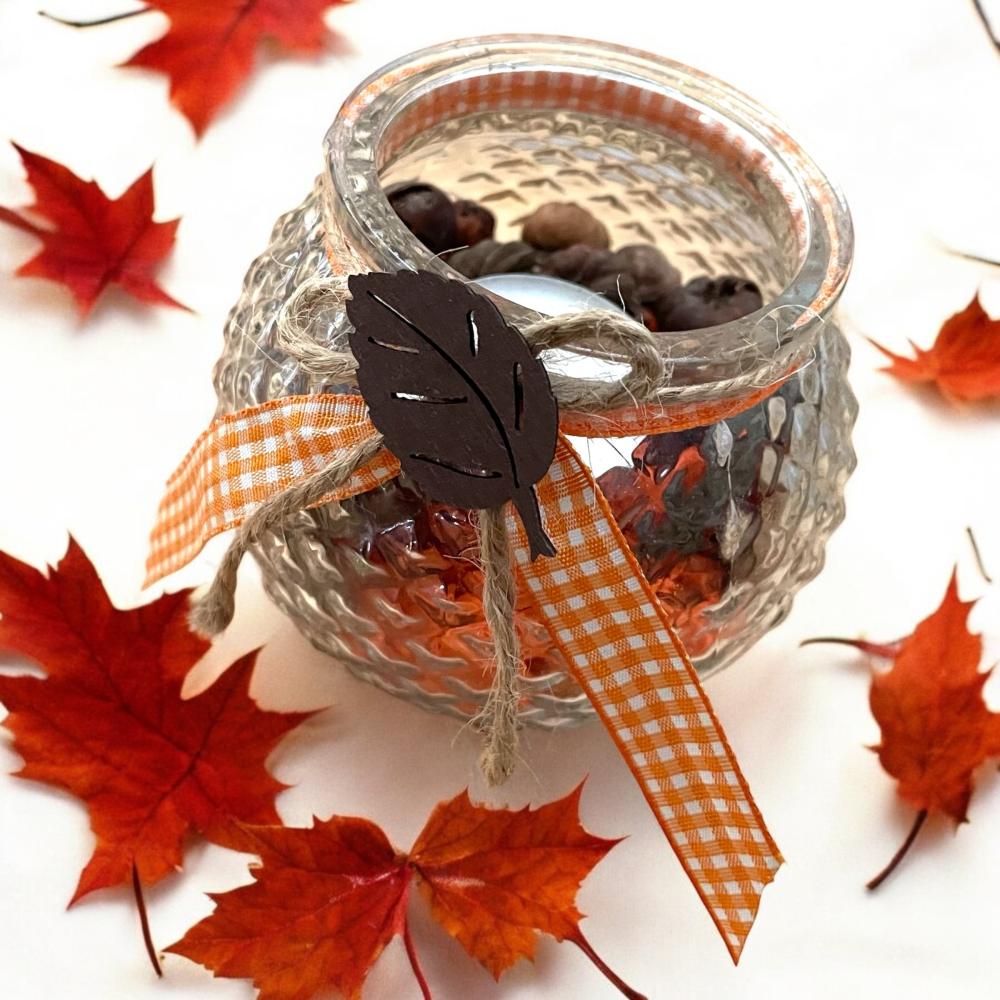 Petit photophore avec décorations d'automne