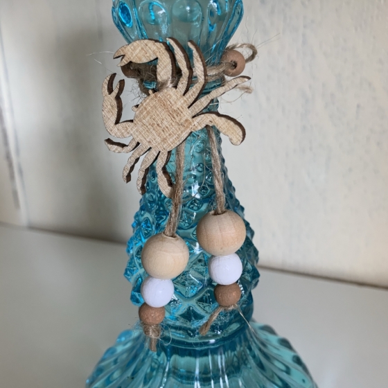 Bougeoir en verre avec décorations thème marin.